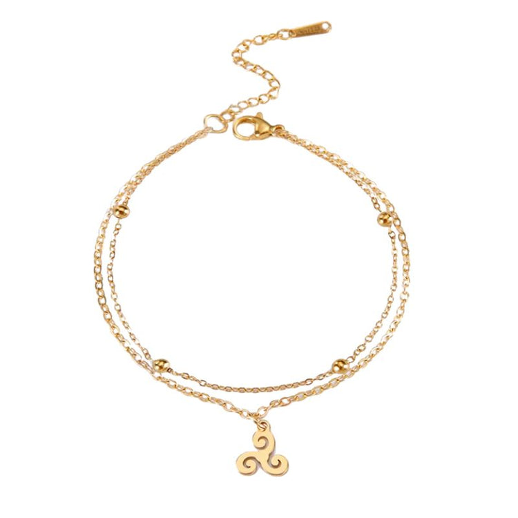 Bracelet Triskell en or avec double chaîne et pendentif en spirale