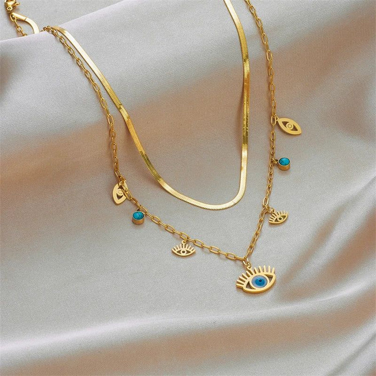 Collier Oeil Bleu Or et breloques, bijou symbolique de protection