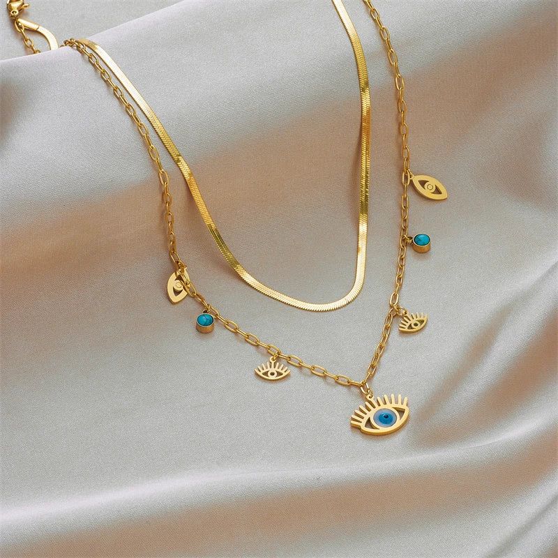Collier Oeil Bleu Or et breloques, bijou symbolique de protection