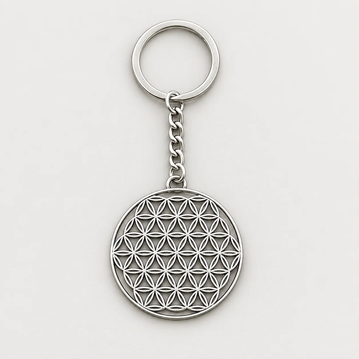 Porte-clé fleur de vie argenté entier sur fond gris clair